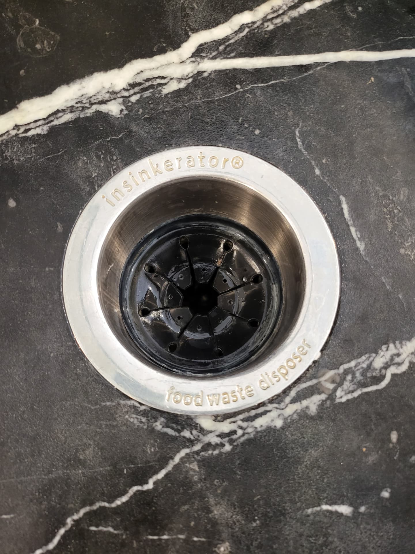 Sink garbage disposal before and after cleaning — after