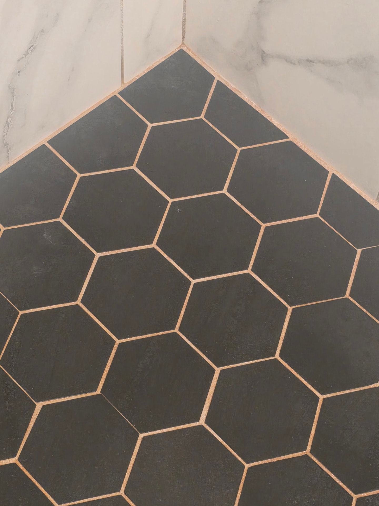 Hex tile floor and grout before and after deep cleaning — before