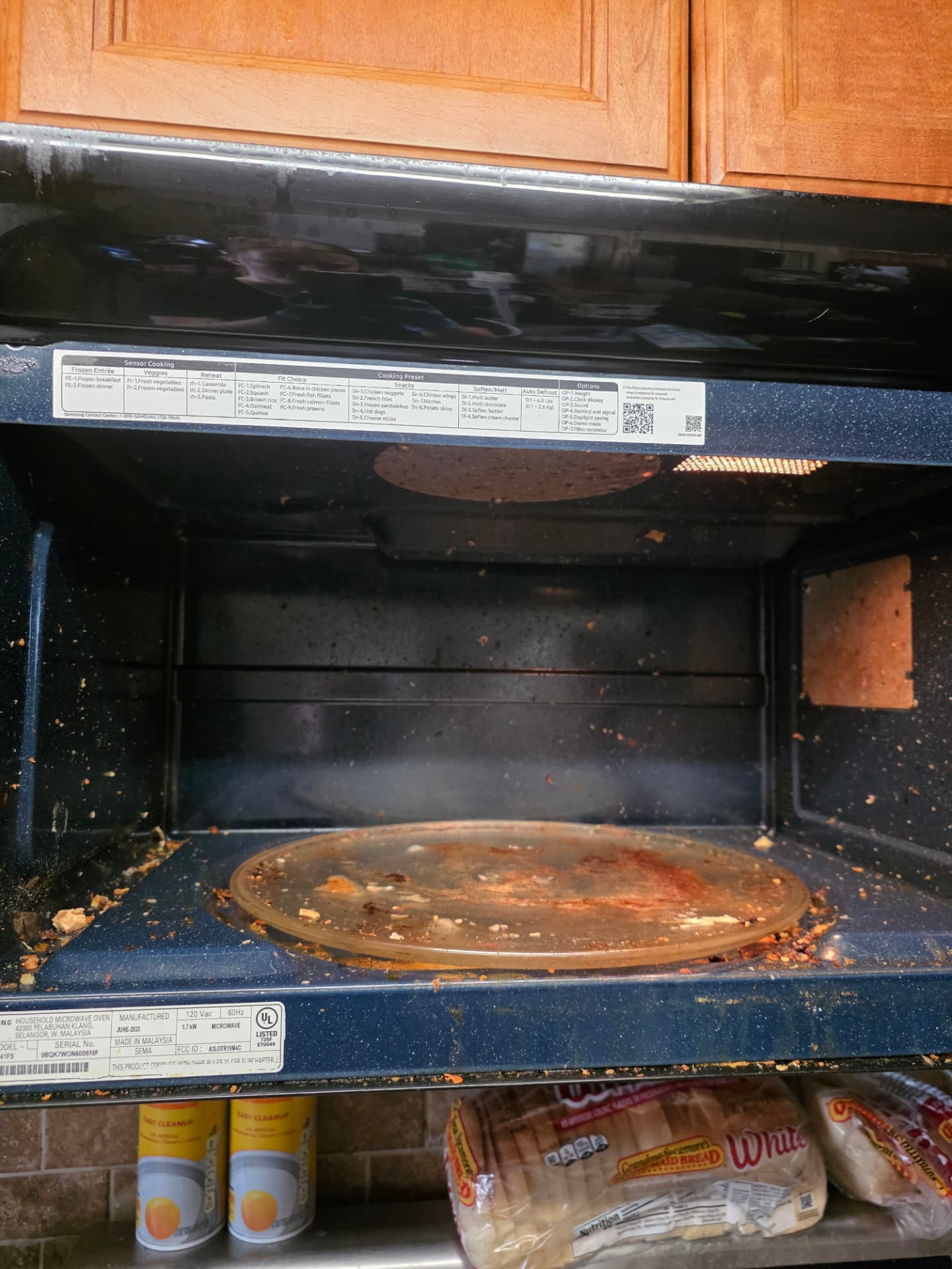 Microwave interior before and after cleaning — before